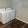 washer and dryer with wood floors at Cary Pines Apartments in Cary, NC