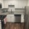 kitchen with white cabinets and stainless steel appliances at Cary Pines Apartments in Cary, NC