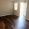 room with wood flooring and a door at Cary Pines Apartments in Cary, NC