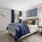 furnished bedroom with large, bright windows at Cary Pines Apartments in Cary, NC