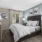 natural lighting pours through large windows in modern styled bedroom  at Cary Pines Apartments in Cary, NC