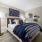 lamp lit bedroom with private access to bathroom at Cary Pines Apartments in Cary, NC