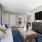 living room adjacent to closet and entryway at Cary Pines Apartments in Cary, NC